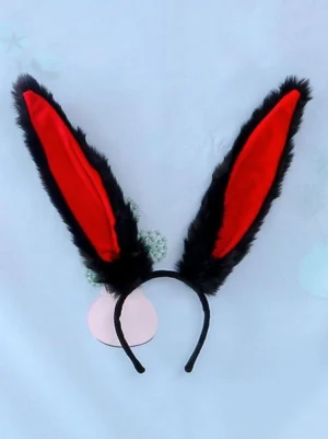 Black fluffy bunny ear lolita headband with red inner lining and black plastic headband, front flat lay styling shot with light blue backdrop and decorative props