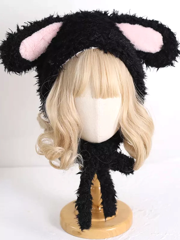 Side view of black plush rabbit ear hat with curled long black straps on blonde mannequin