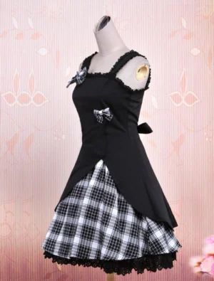 Black gingham gothic Lolita jumper skirt left side view displaying asymmetrical top layer and small back bow accent on dress form