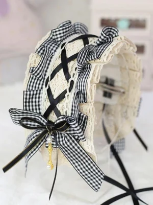 Side profile view of black gingham lolita headband showing lace-up design with pearl and key charm and trailing ribbons