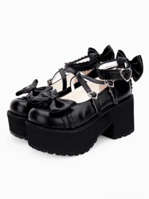 Black glossy lolita platform pumps with multi-strap bow design and heart hardware, front oblique angle displaying lustrous PU leather finish and statement block heel