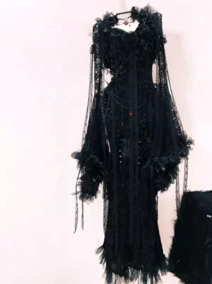 Black gothic mermaid lolita dress with 3D rose appliques full left rear view showing bell-shaped sheer lace sleeves and tassel hem detail