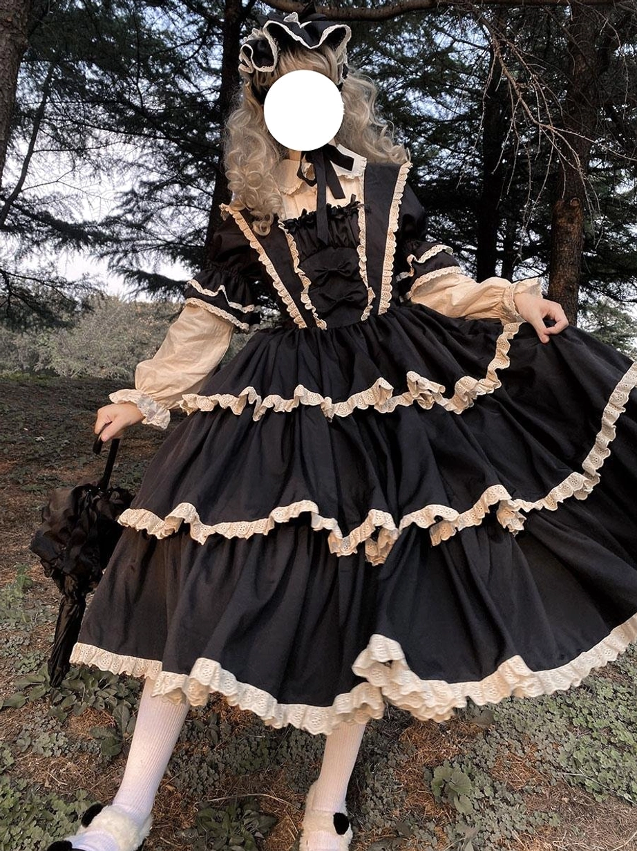 Black gothic fairy lolita dress back view showing layered ruffled skirt with lace edges square back neckline and hair bonnet