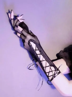 Black gothic fingerless fishnet oversleeves with crisscross ribbon lace-up closure and ruffled edges, displayed on model's hands against purple background - side top view showing detailed lacing pattern and construction