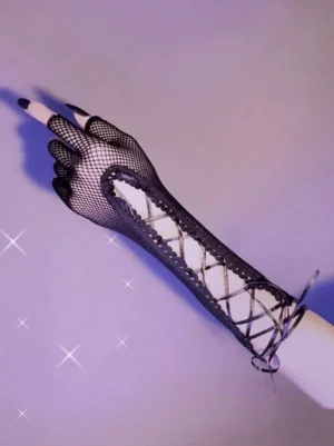 Single black fishnet fingerless long glove with hollow crisscross lacing pattern and adjustable wrist tie strap, displayed on hand against sparkly purple background - front view detail shot
