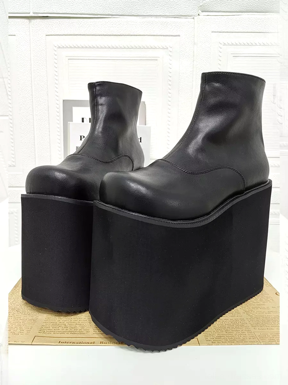 Paired black gothic lolita platform ankle boots front three-quarter close-up view showing clean matte finish thick platform sole and rear zipper design details