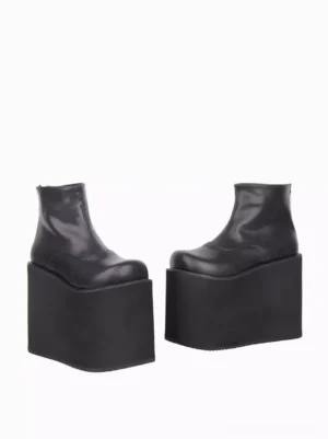 Black gothic lolita wedge heel ankle boots side profile view showing minimalist silhouette rear zipper closure and thick rubber wedge sole