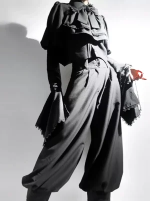 Black gothic lolita high-waisted bloomers with ruffled lace collar and flared lace cuffs front view on model