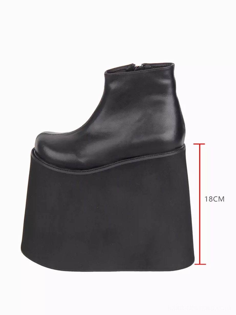 Single black Gothic Lolita boot right side profile with height scale demonstrating 18cm ultra-thick wedge platform, smooth PU leather construction, and substantial platform elevation