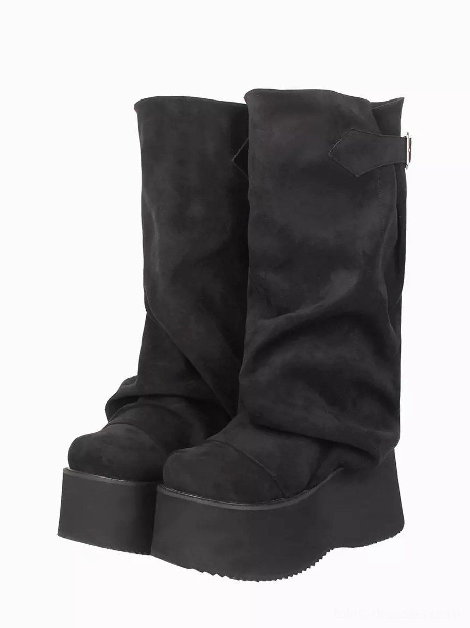 Black slouchy gothic lolita mid-calf boots with adjustable buckle strap - front three-quarter pair view showing corduroy texture, wedge platform heel, and grommet embellishments