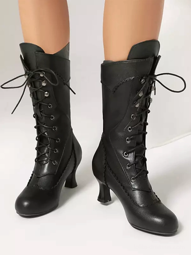 Classic black lolita boots with metal lace eyelets and curved kitten heel paired front studio view