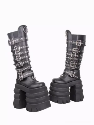 Pair of Gothic Lolita knee-high boots side profile, grommet-adorned straps, stacked platform heel, three-quarter angle display
