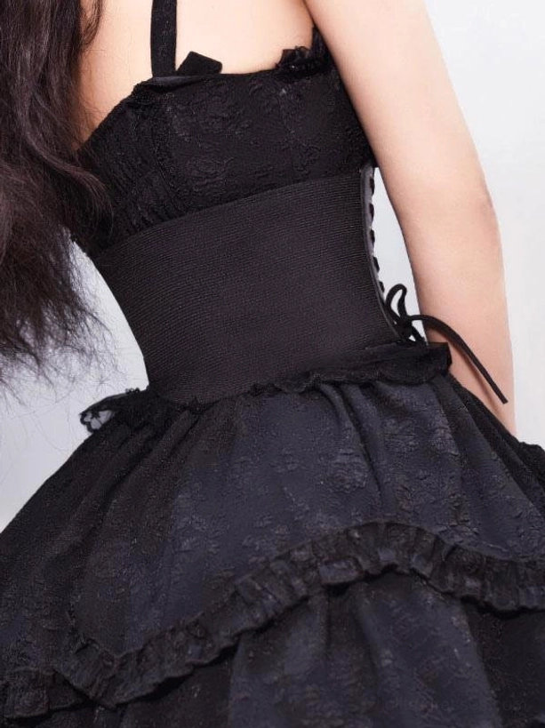 Black Gothic Lolita corset outfit back view displaying rear lace-up corset construction and layered ruffled skirt silhouette