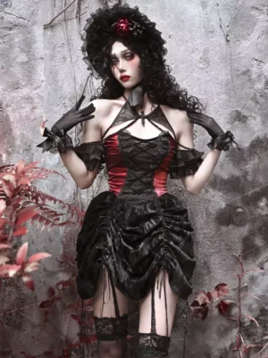 Black Gothic Lolita corset dress with lace off-shoulder ruffles and color block design, front full-body view worn by female model with gothic hat and curly hair in vintage stone courtyard setting