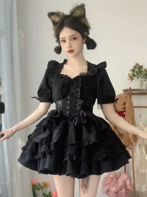 Black gothic lolita two-piece outfit with heart-shaped neckline, lace-up corset top, ruffled puff short sleeves, and layered ruffle mini skirt front view flat lay