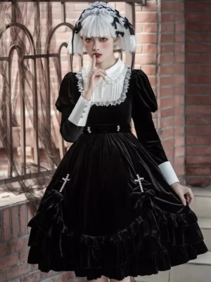 Black gothic lolita dress with cross embellishment front full-body view model wearing long sleeves and white peter pan collar