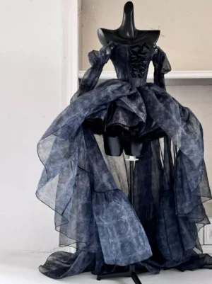 Black Gothic Lolita dress with detachable puff sleeves and high-low organza train front-side full view on mannequin