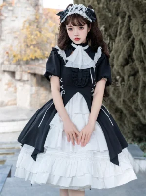 Black gothic lolita dress back view showing short puff sleeves, ruffled neck panel, lace-up bodice, and layered white underskirt
