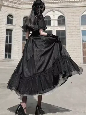 Black Gothic Lolita dress back view showing ruffled hem and high-waisted silhouette with structured lace overlay design