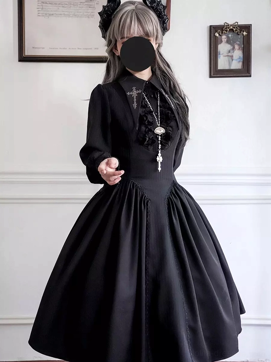 Black Gothic Lolita long sleeve dress front full-body shot, featuring cross embroidery on collar, fitted waist, full midi skirt, decorative hair accessories, and cross pendant necklace