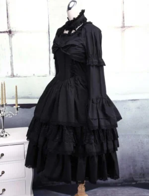 Black Gothic Lolita dress front three-quarter angle displaying fitted bodice corset style, layered ruffled skirt and long sleeves