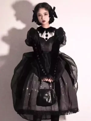 Black Gothic Lolita dress full body front view with sheer puff sleeves white collar tulle overskirt bow hair accessories mini handbag