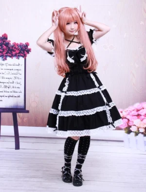 Full front view of classic Gothic Lolita dress with layered lace skirt, high-waisted silhouette, white dotted stockings and Mary Jane heels