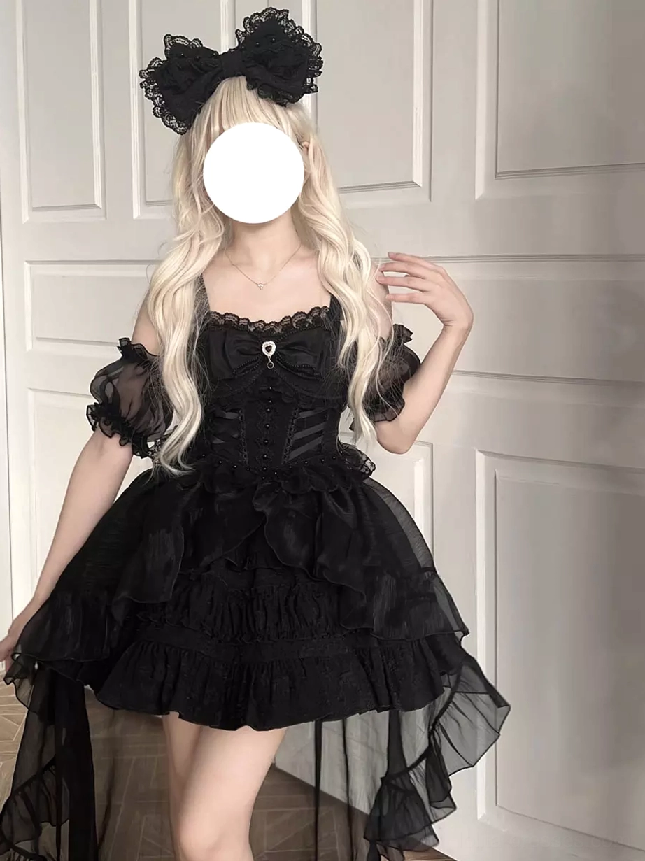 Black gothic lolita dress with off-shoulder puff sleeves lace neckline and short ruffled skirt with sheer tulle train front half-body view