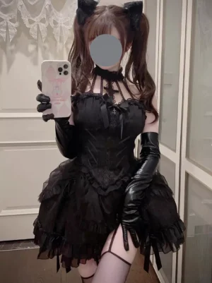 Black Gothic Lolita dress with leather oversleeves halter neck front view mirror selfie with twin ponytails