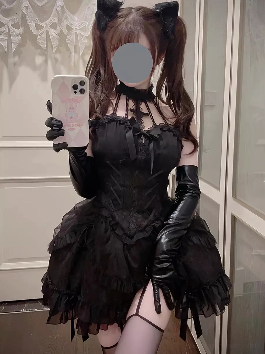 Black Gothic Lolita dress with leather oversleeves halter neck front view mirror selfie with twin ponytails