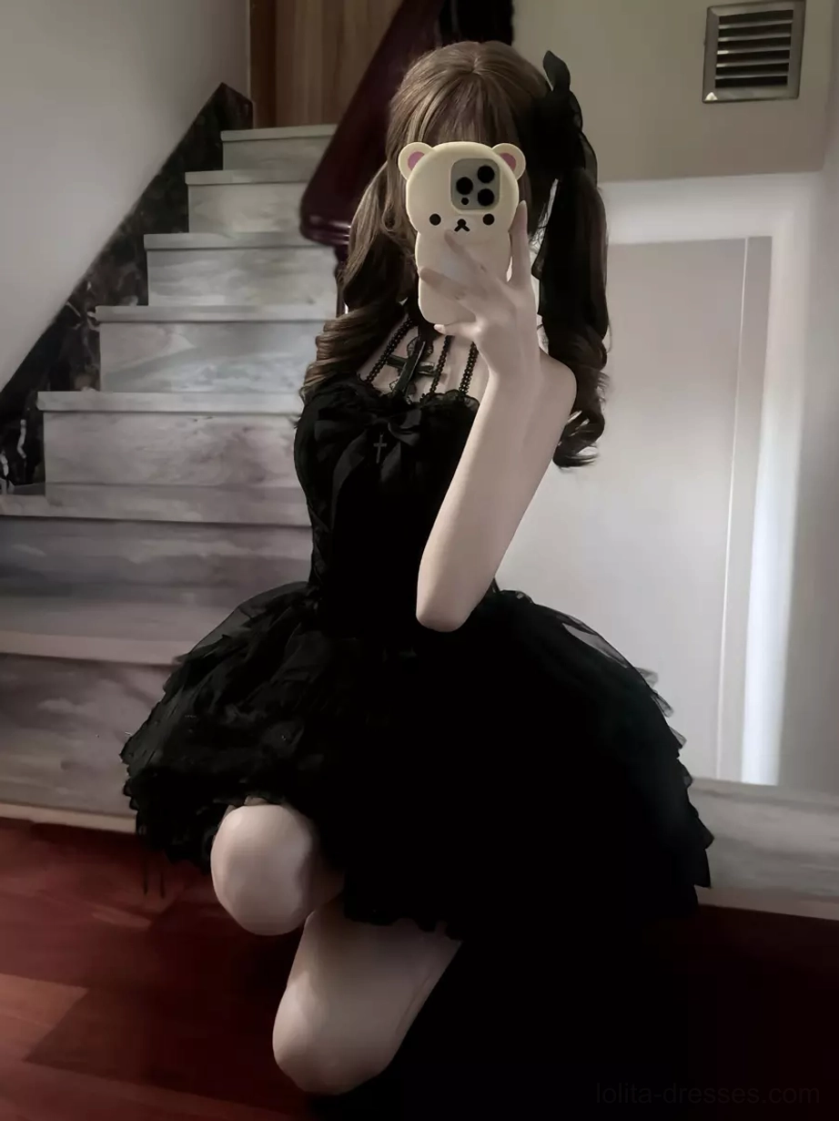 Black Gothic Lolita dress low angle fitted bodice short flouncy skirt indoor setting