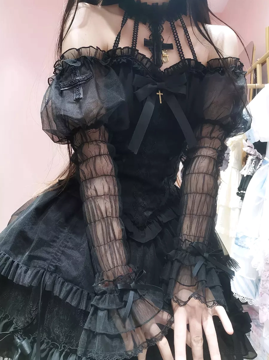 Black Gothic Lolita dress off-shoulder neckline sheer ruffled sleeves cross bow tiered skirt close-up