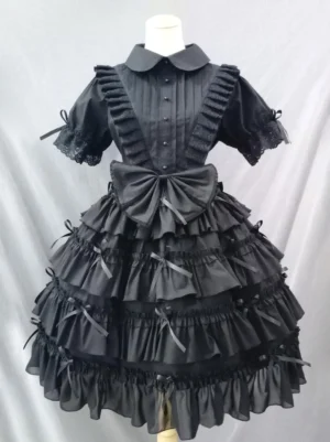 Black gothic lolita dress front view with Peter Pan collar large waist bow lace-trimmed ruffled short sleeves multi-layer ruffled skirt satin bows authentic lolita styling