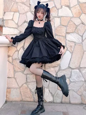 Black gothic lolita mini dress side view with dynamic posing, black boots and stockings, layered lace hem detail - outdoor stairway setting