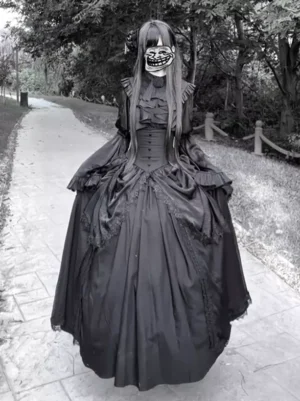Black Gothic Lolita dress front view with layered ruffled skirt, ruffled collar, and structured corset bodice worn by masked model outdoors in park setting