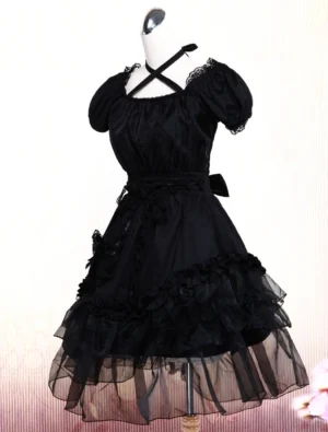 Black gothic lolita dress three-quarter side view showing side floral embellishment ruched waistline classic lolita silhouette