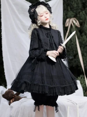 Black Gothic Lolita one-piece dress side profile showing A-line silhouette, ruffled hem, and lantern sleeves