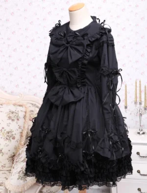 Black Gothic Lolita dress side view showing ruffled front panels and ribbon bow details