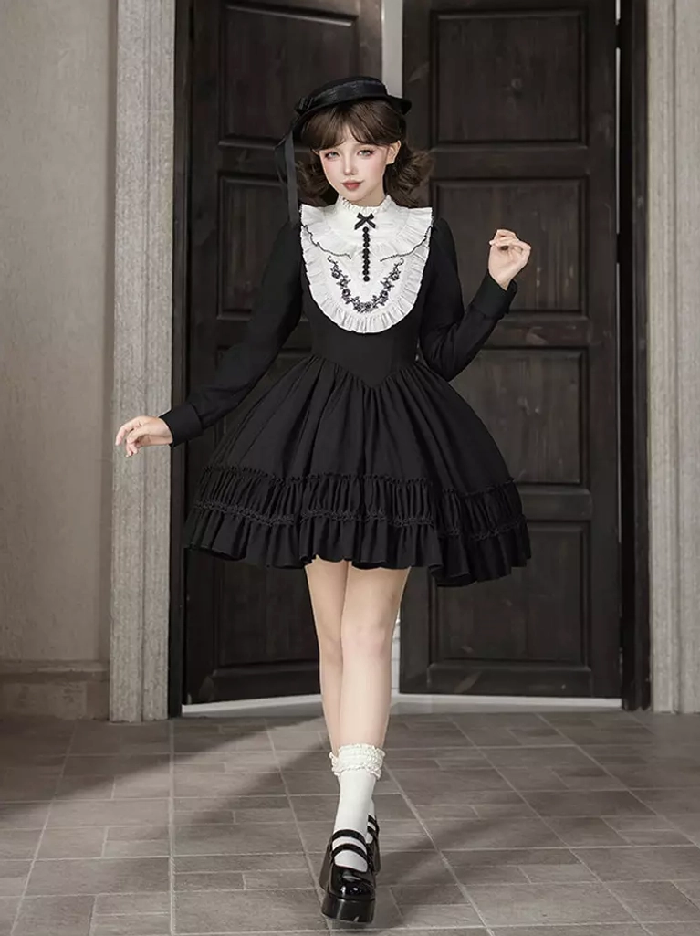 Full-length Gothic Lolita short dress featuring square neckline, long sleeves, tiered ruffles, and coordinating black hat, indoor front view
