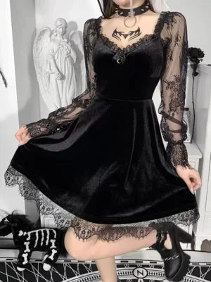 Black gothic lolita velvet dress front three-quarter view featuring sweetheart neckline, long sheer floral lace sleeves, A-line silhouette, and decorative satin bow with moon charm detail on gothic home background