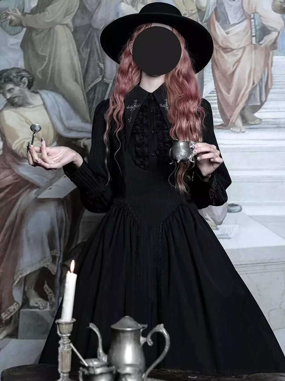Black Gothic Lolita long sleeve dress three-quarter front angle, displaying ruffled chest detail, long sleeves, fitted waist, full midi skirt, worn with wide-brimmed hat and metal teacup