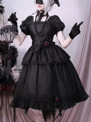 Black gothic lolita opera dress with tiered ruffles and red rose accents, three-quarter front view showing puff sleeves and dramatic skirt layers