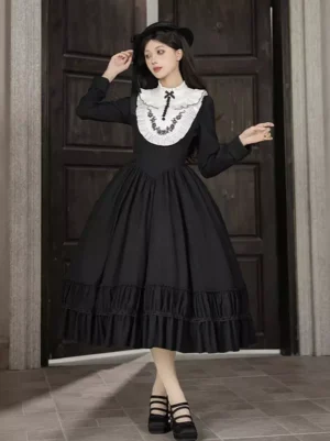 Black Gothic Lolita long sleeve dress with tiered ruffled skirt front view featuring white embroidered collar and black bow