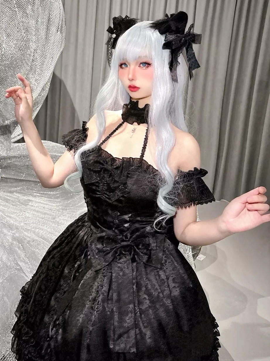 Black Gothic Lolita dress waist and bow placement detail showing silhouette structure and ruffled skirt construction