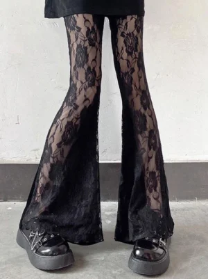 Black gothic lolita flared pants with rose lace pattern, sheer overlay, platform leather shoes styling, front lower-body view