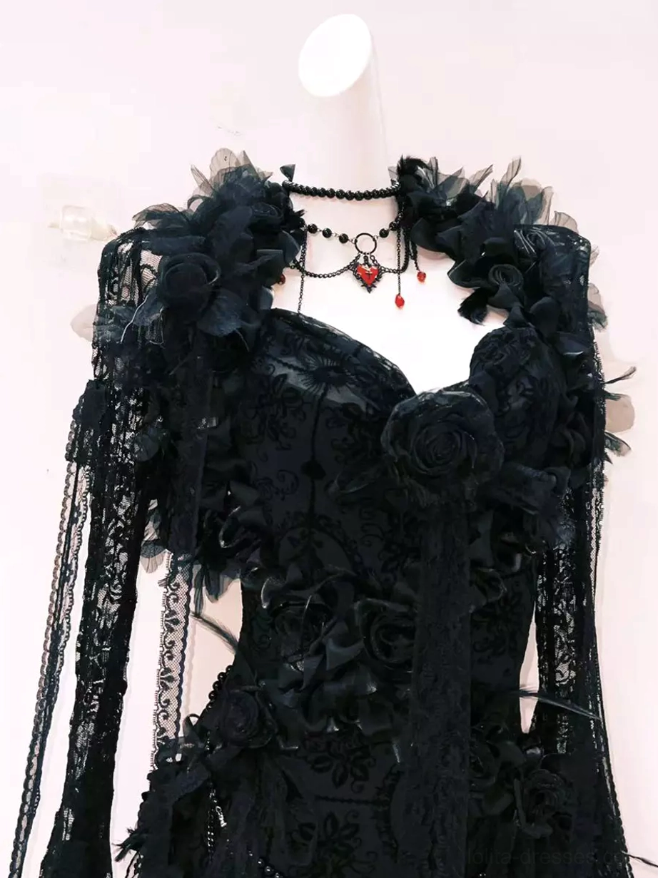 Black gothic lolita dress front medium close-up showing 3D floral shoulder decorations sweetheart bust and red heart pendant