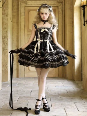 Gothic Lolita JSK dress full front view on blonde model wearing black choker, platform heels, spaghetti straps, and layered ruffled skirt with lace trim details