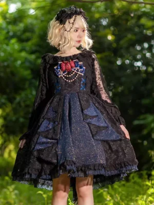 Black gothic lolita JSK dress with lace overlay and pearl bust embellishments worn by model in outdoor forest setting showcasing sleeveless design and layered skirt
