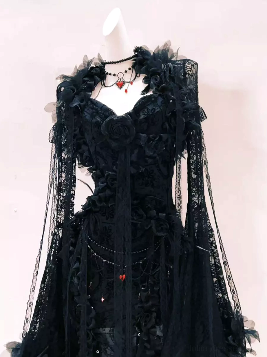 Black gothic lolita dress front upper close-up showing sheer long lace sleeves layered lace skirt and heart pendant necklace
