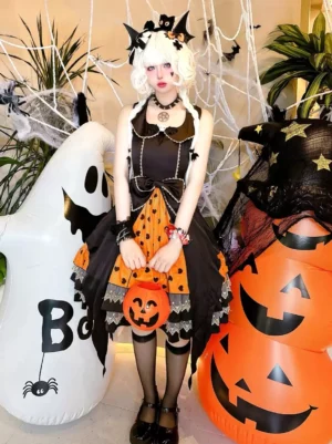 Black Gothic Lolita Jumper Dress front view with heart lace pattern and orange Halloween-themed accessories
